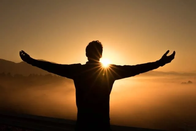 Man standing towards the sunset